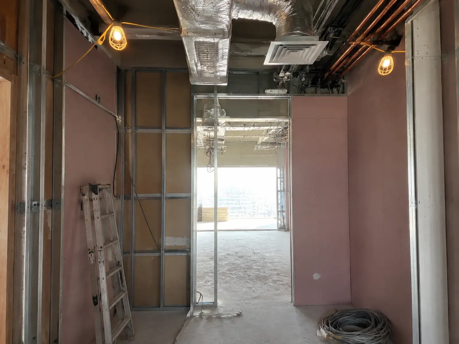 Clinic fit-out in progress in Dubai with ductwork, containment and medical gas pipework at first fix