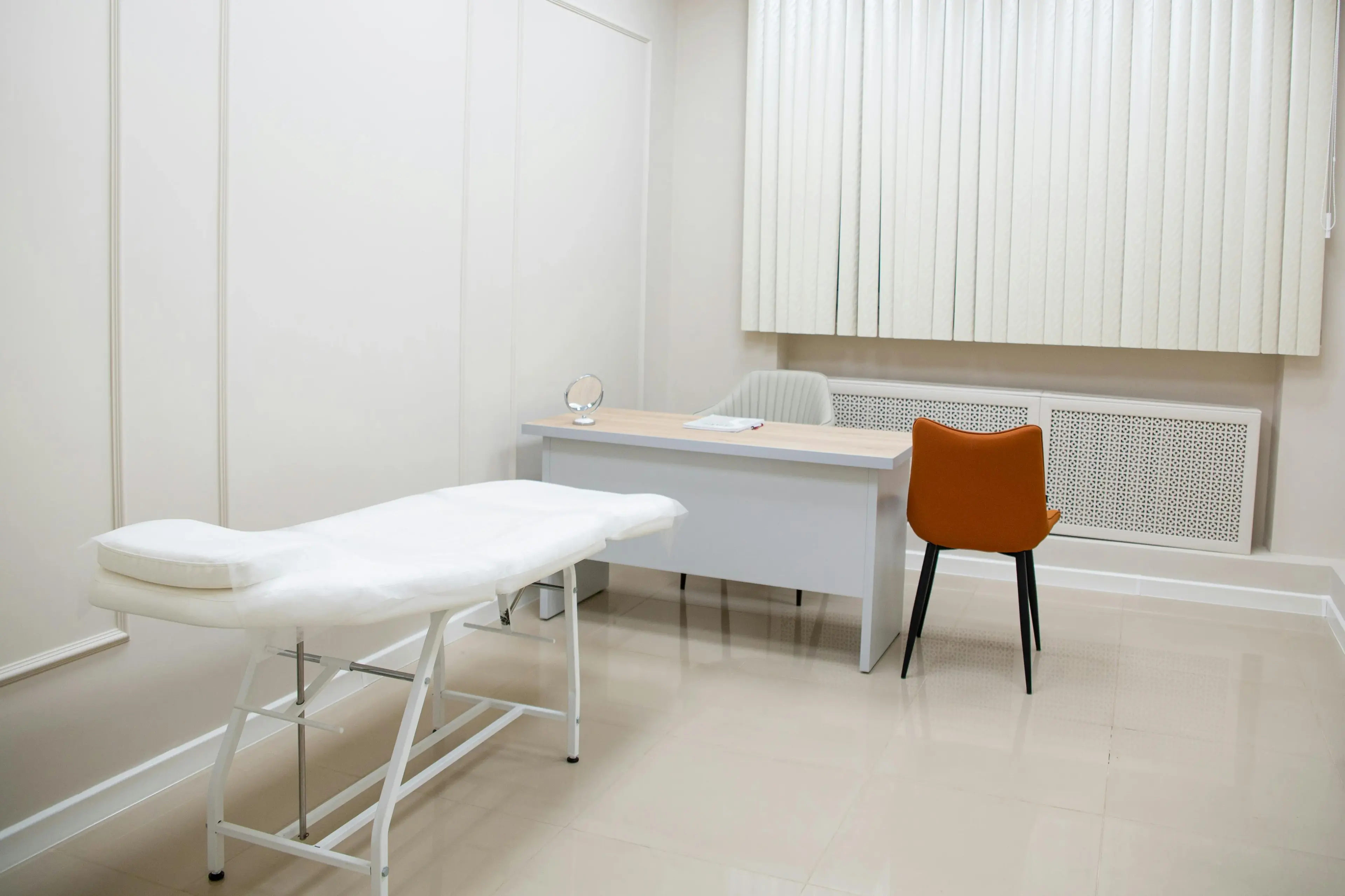 Clinic consultation suite with sealed wipeable flooring, coved skirting and flush ceiling detailing