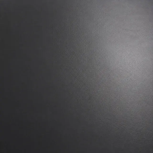 Close detail of charcoal satin lacquer with a soft reflected sheen