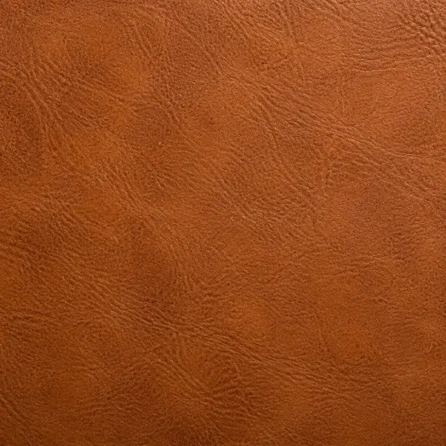 Close detail of cognac full-grain leather and its natural patina