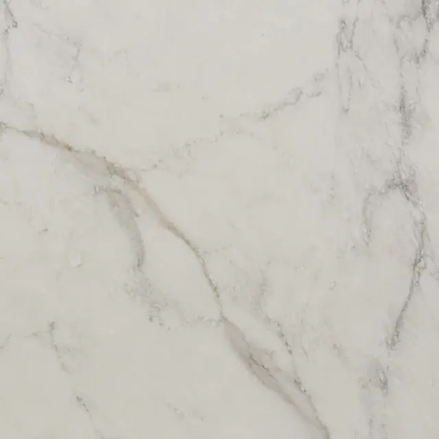 Close detail of warm white honed marble with natural grey veining
