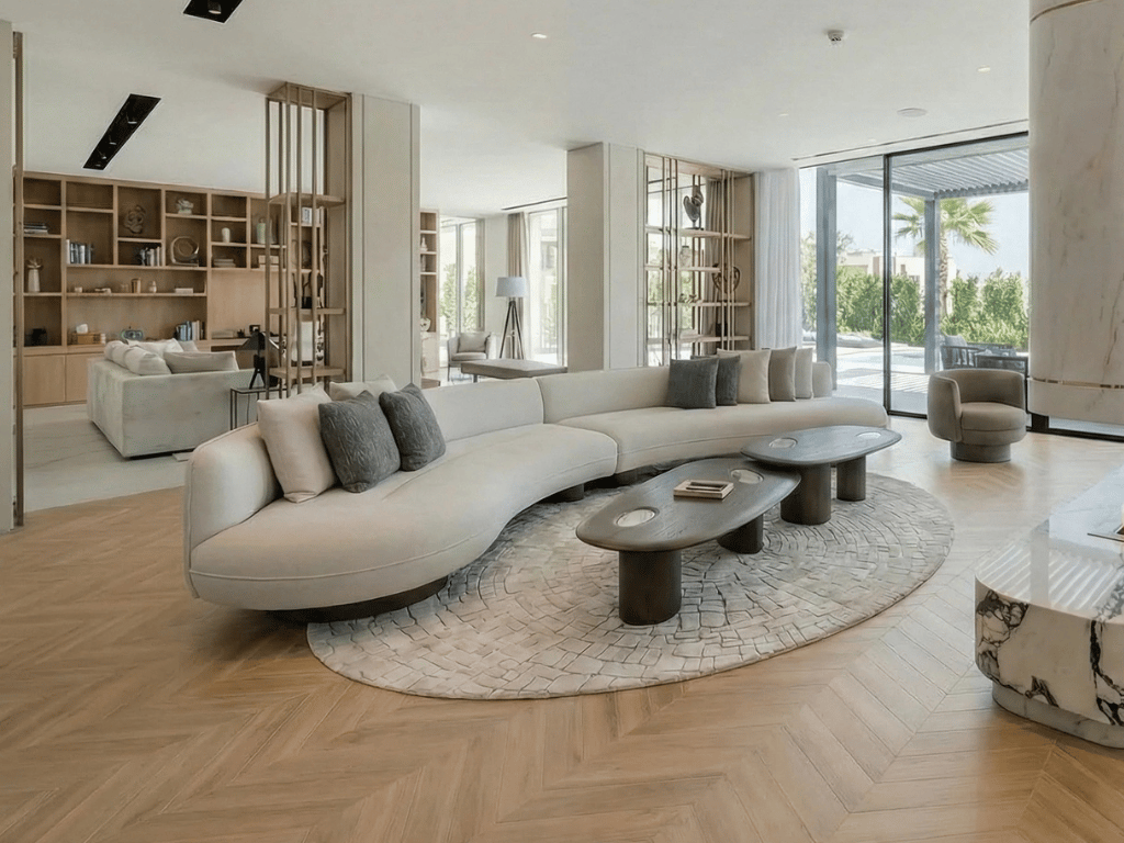 Custom-upholstered curved sofa in a Dubai living room, made by Halo