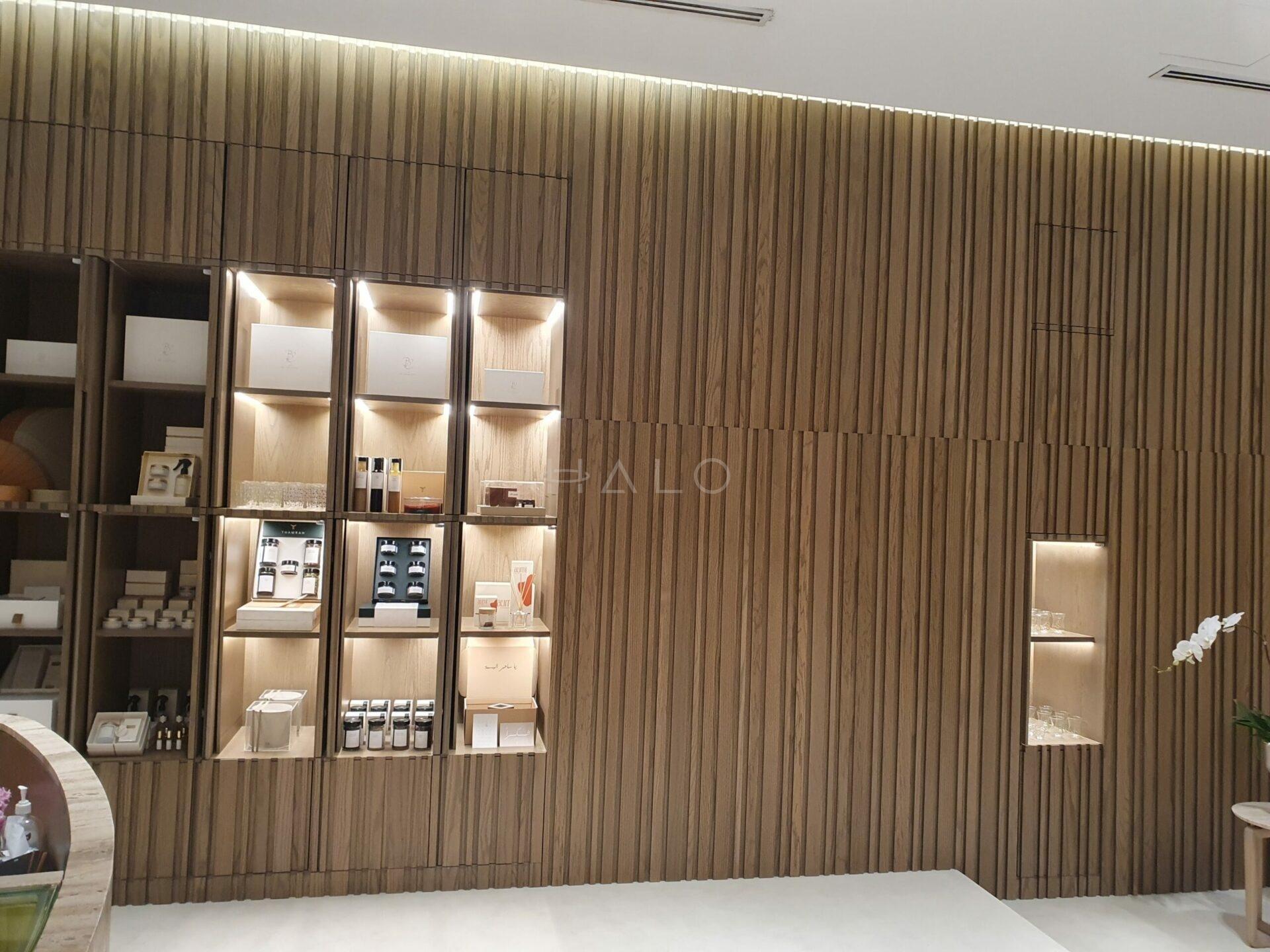 Completed retail store fit-out with display shelving and feature wall in Dubai — portfolio view 01