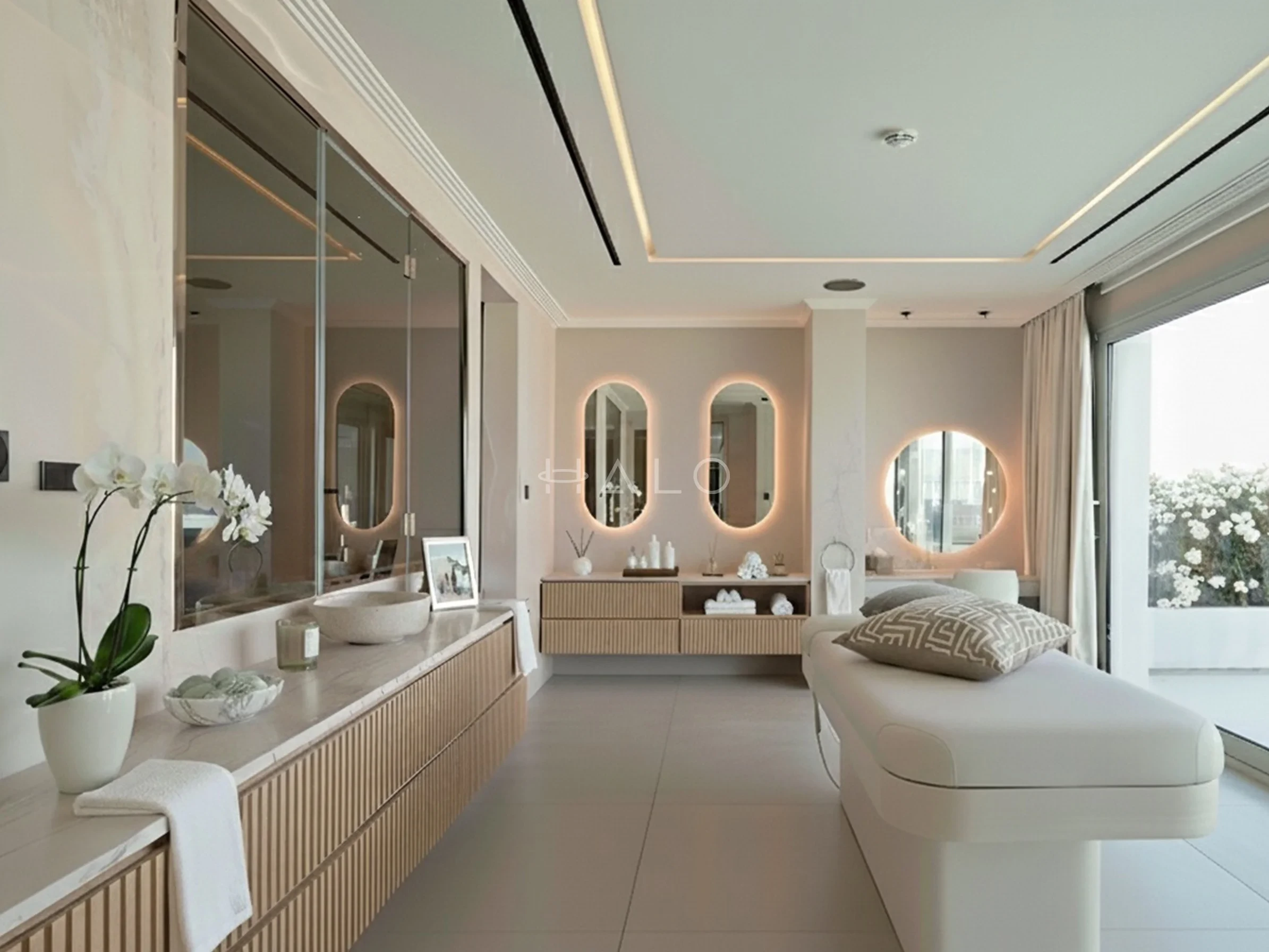 Villa bathroom finished in large-format stone with bespoke vanity