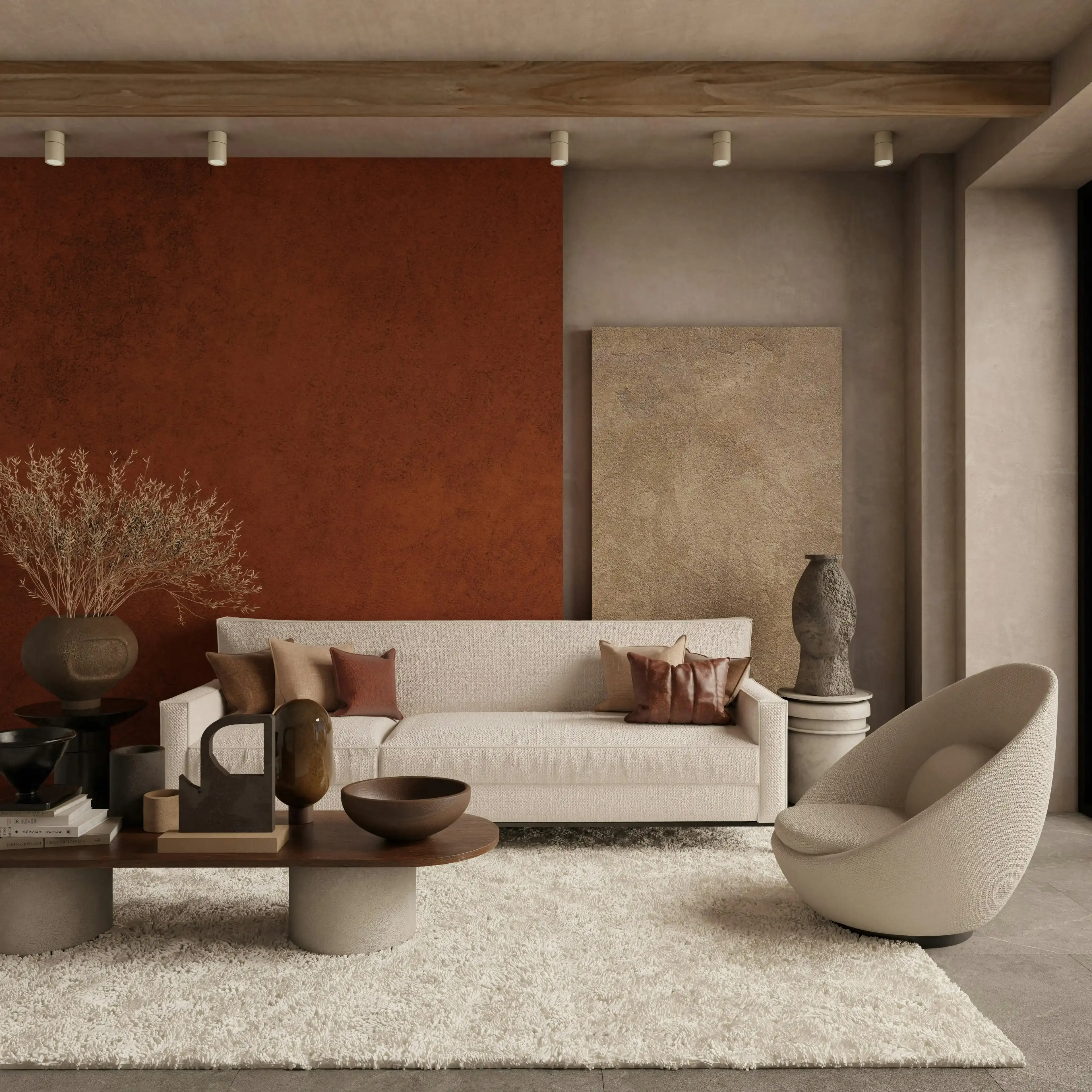 Warm terracotta and clay-toned wall panels with a low cream sofa and dried grasses