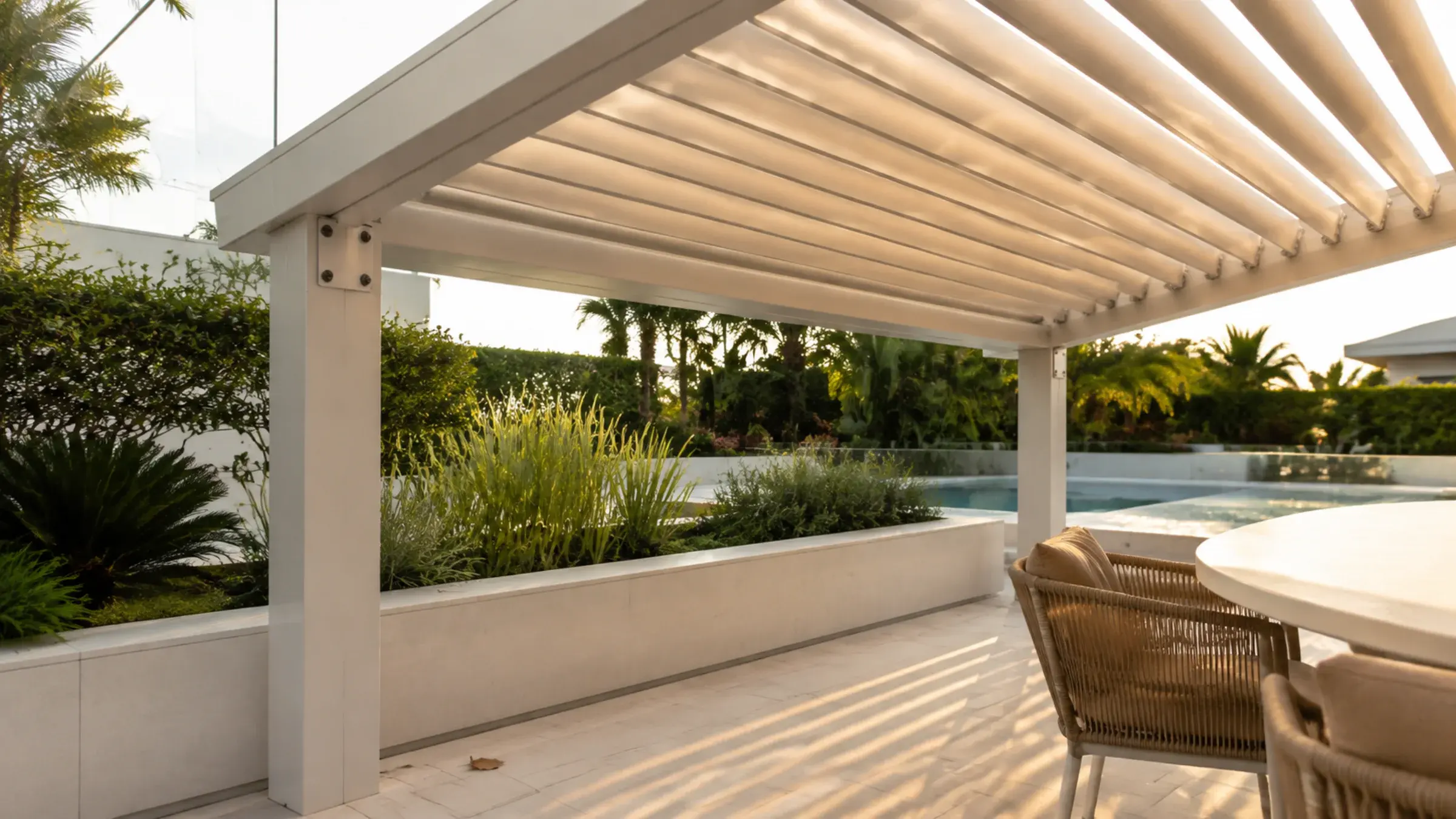 Timber-look pergola over a shaded terrace beside planting and a pool