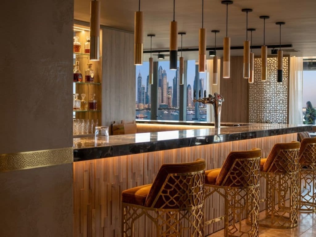 Bespoke restaurant bar counter and back-bar joinery manufactured by Halo in Dubai