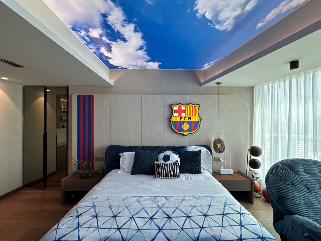 Printed sky stretch ceiling with clouds above a themed bedroom fit-out in Dubai by Halo